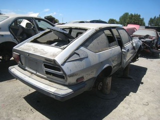 Illustration for article titled This Junkyard Alfa Romeo GTV6 Won't Get To Go Out In A Blaze Of Racin' Glory